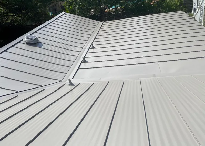 Solar attic fan installed on a metal roof for Roof Ventilation in Lower Merion